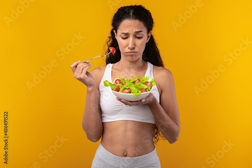 Portrait of Sad Lady Holding Plate With Vegetable Salad