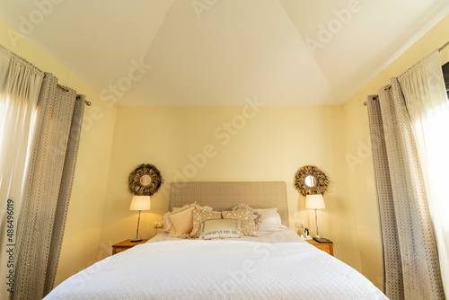 a view of a bed and wall features inside a bedroom of a villa along the costa del sol 