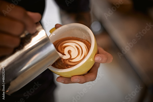 Hot latte art making by barista