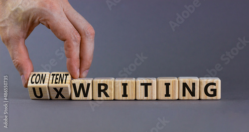 Content or UX writing symbol. Businessman turns cubes changes concept words content writing to UX writing. Beautiful grey background copy space. Business content or UX user experience writing concept.