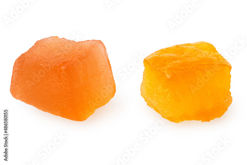 Two pieces of glazed dried fruit isolated.