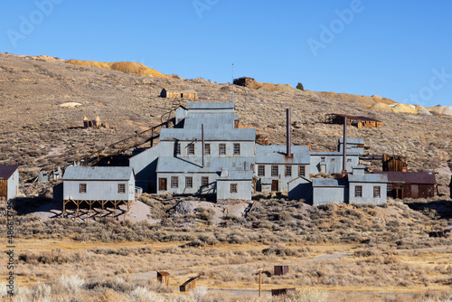 Old tin buildings of abandoned Gold Mine in Bodie Ghost town in the Eastern Sierra Nevada Mountian Range.