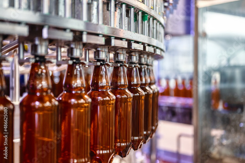 Filling plastic bottles with various drinks on an automatic filling machine