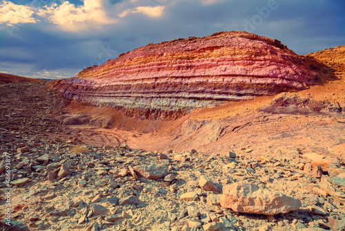 Mountain desert landscape. Colorful sandstone mount in National Park Makhtesh Ramon Crater in Negev desert, Israel