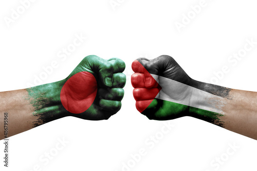 Two hands punch to each others on white background. Country flags painted fists, conflict crisis concept between bangladesh and palestine