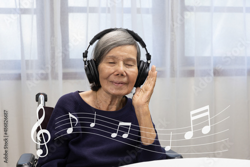 Music therapy in dementia treatment on elderly woman.