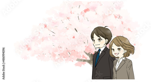 スーツ姿の男女と桜