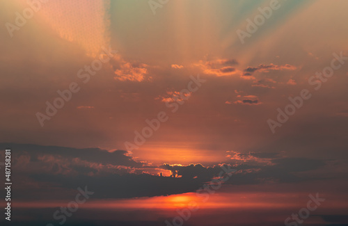 Beautiful orange sunset sky above clouds with dramatic light, Beautiful blazing sunset landscape, Copy space, No focus, specifically.