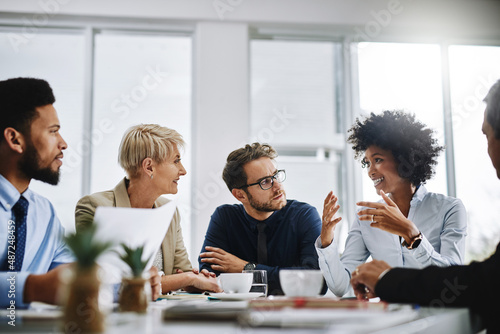 I need everyone to give me their best ideas. Shot of a group of businesspeople sitting together in a meeting.