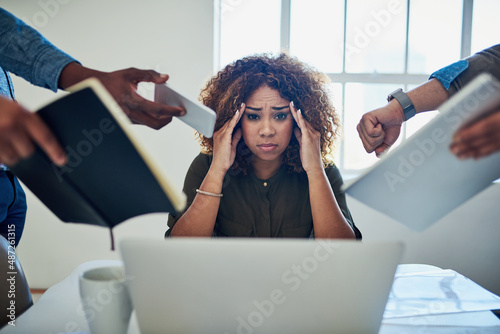 Can I get a moment to breathe. Shot of a stressed out young woman working in a demanding career.