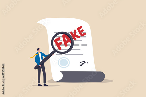 Fake document, wrong information verification or fake news inspection, fraud and illegal reports concept, smart businessman inspector using magnifying glass to verify fake document.