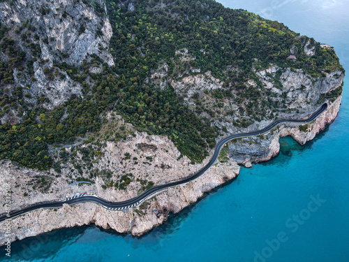 Aerial view of Aurelia street in Noli, Capo Noli and Varigotti, province of Savona. Drone photography from above of snake street snake in Liguria, north Italy, near Bergeggi and Spotorno.