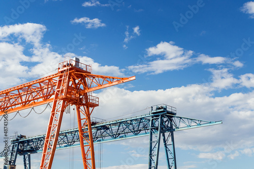 Gantry cranes against a blue sky