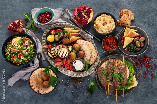 Arabic food assortment on dark background.