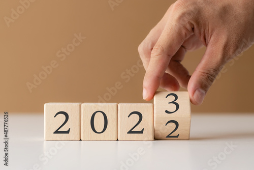 2023 new year goal planning idea, wood block cube with new year 2023 and target icon, business vision.