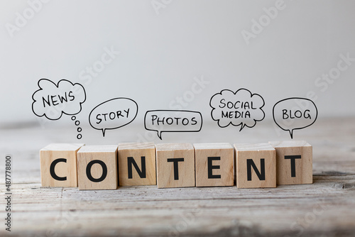Create Content strategy Concept. Content wording on wooden cubes with speech bubbles.