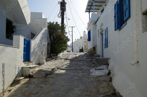 Picturesque view over port town with blue domes, roofs and churches in travel and honeymoon destination Amorgos in the Greek Islands in the Aegean Sea during Mediterranean cruise Summer 