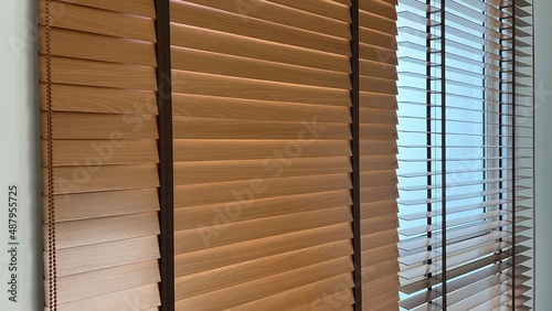 Wooden blinds for interior use on window of house