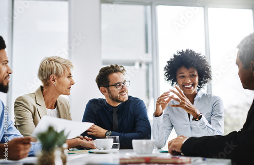 With the help of the whole team, anything is possible. Shot of a group of businesspeople sitting together in a meeting.