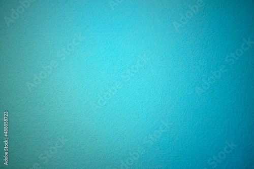 Blue texture of soft cardboard. Clear blue background. A clean place for a congratulatory text.High quality photo