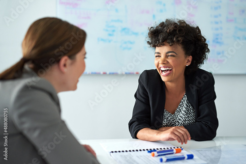 Theyve got great coworker rapport. Shot of two businesswomen enjoying a meeting together at work.