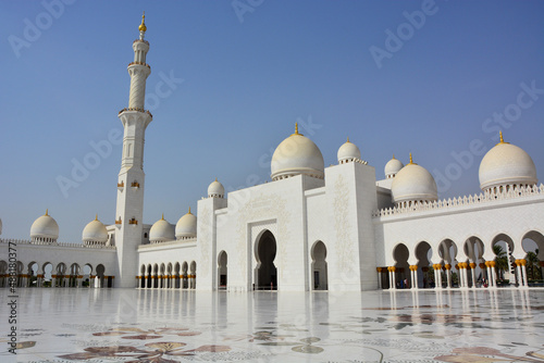 Sheikh Zayed Grand Mosque, courtyard of world's largest mosque located in Abu Dhabi, in United Arab Emirates; arabesque flower patterns on floor