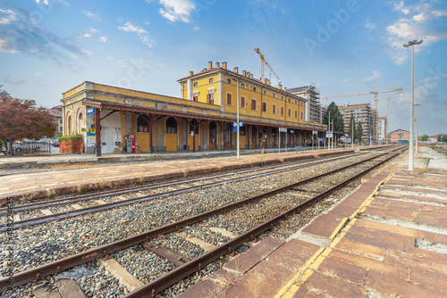 Saluzzo, Cuneo, Italy - October 19, 2021: Old railway station of the Saluzzo - Savigliano line, seen from the platforms of the tracks