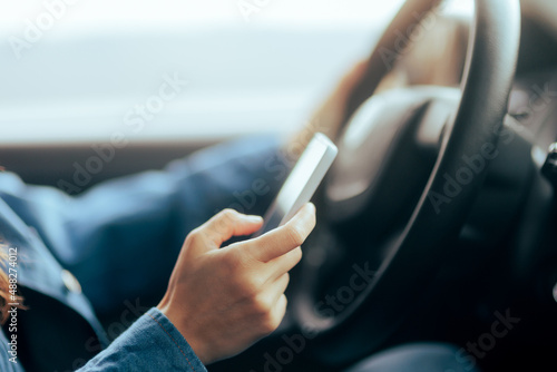 Irresponsible Driver Texting and Driving at the Same Time