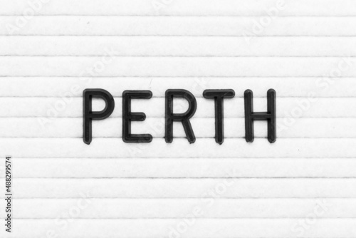 Black color letter in word perth on white felt board background