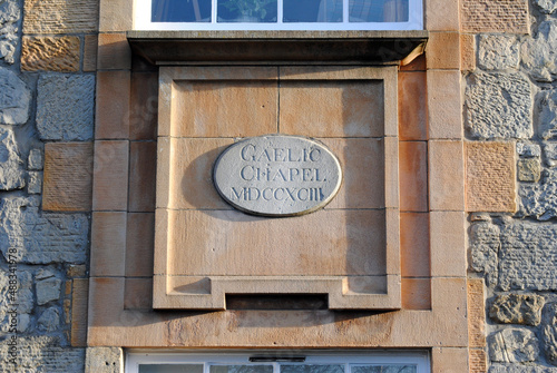 Detail of Carved Stone Plaque with Roman Numerals on Ancient Chapel 