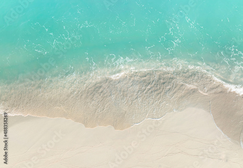 Turquoise color of wave water background on the summer beach at the seashore and white sand beach -Summer pattern image