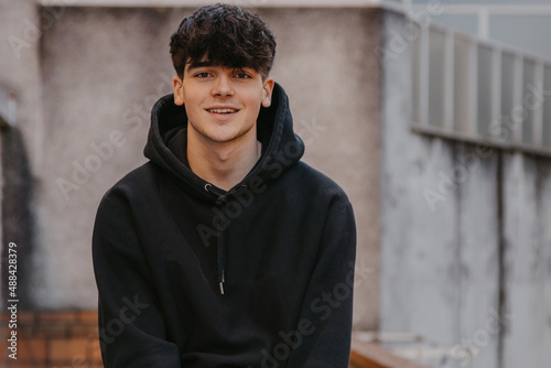 portrait of smiling teenager on the street outdoors