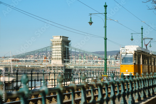 Old yellow tram as a public transport in historic Budapest city and tourist attractions of Hungarian capital