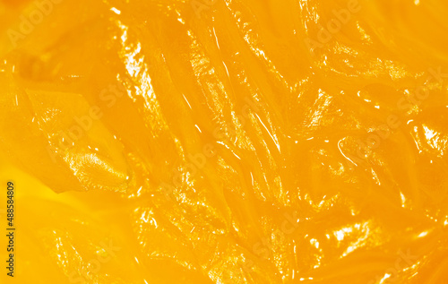 Juicy orange pulp as a background.