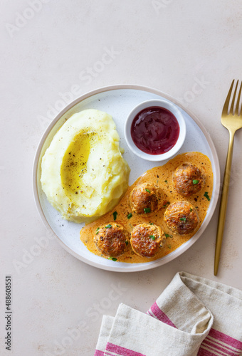 Swedish meatballs in cream sauce, potatoes and lingonberry sauce. Swedish cuisine. Recipe.