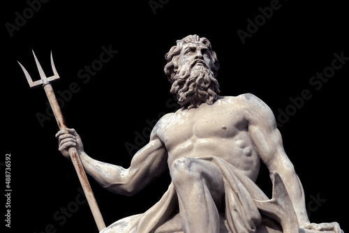 The mighty god of the sea and oceans Neptune (Poseidon) The ancient statue isolated on black background.