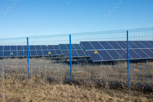 Private Solar panel field behind a protective fence