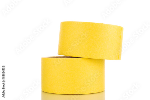 Two painter's tape, yellow, macro, isolated on a white background.