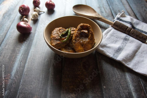 Popular Bengali non vegetarian dish fish kalia or masala served in a bowl.