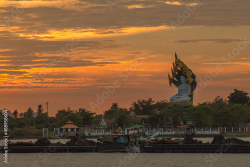 Sunset river landscape in Thailand with Naka God of Snake Statue 