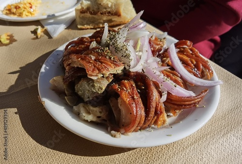 kokoretsi meat traditional in greece in the plate with onion and oregano
