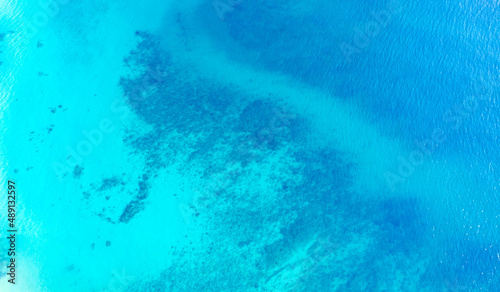 High aerial view of the beautiful seascape on tropical summer. Ocean view with rocks under the blue sea.