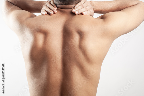 trapezius muscle soreness, neck pain, upper back spine pain