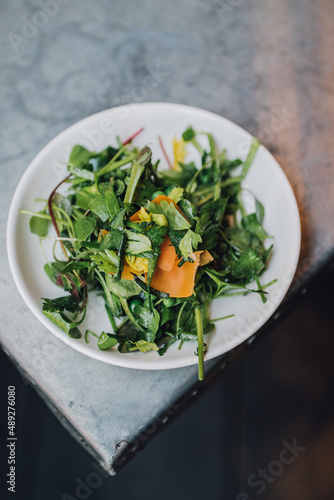 wild watercress salad with peas and orange mimolette cheese