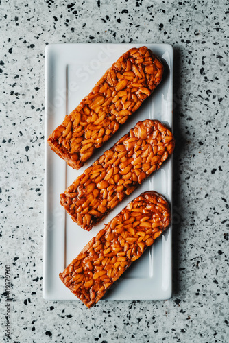 blocks of marinated tempeh in a white plate