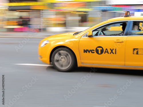 Taxi in New York - lens and motion blurred. Taxi in New York - lens and motion blurred.