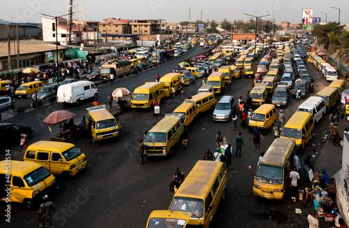 Lagos city bus park - Endless Streams of danfo navigating the bustling traffic of Lagos 