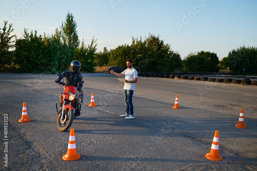 Riding between cones, lesson in motorcycle school