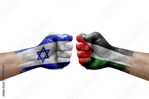 Two hands punch to each others on white background. Country flags painted fists, conflict crisis concept between israel and palestine