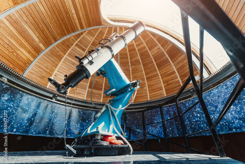 A professional telescope in a space observatory with automatic bearing and platform rotation mechanisms